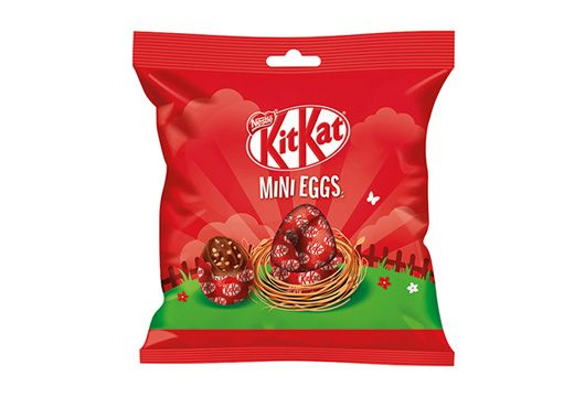 Scopri KitKat Mini Eggs ovetti di cioccolato Confezione rossa di KitKat Mini Eggs ovetti di cioccolato su sfondo bianco