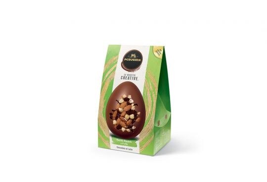 A Pasqua scopri l’uovo di cioccolato al latte Le Ricette Creative Confezione uovo di cioccolato al latte Le Ricette Creative in scatola verde con immagine dell’uovo con ingredienti a vista